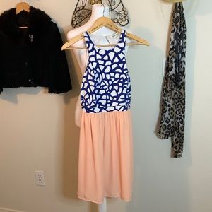 Jealous Tomato mini dress, A line with open back and sleeveless.